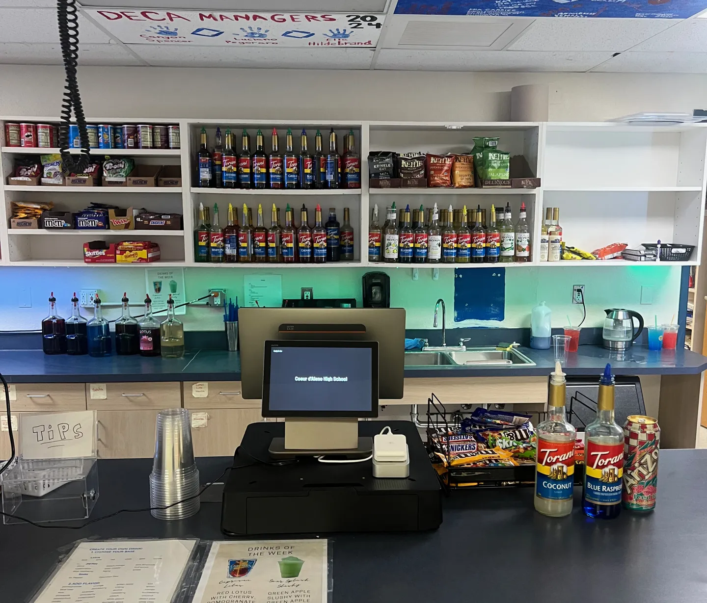 Live at the counter: the register running Coeur d’Alene High School, drinks-of-the-week menu and all.